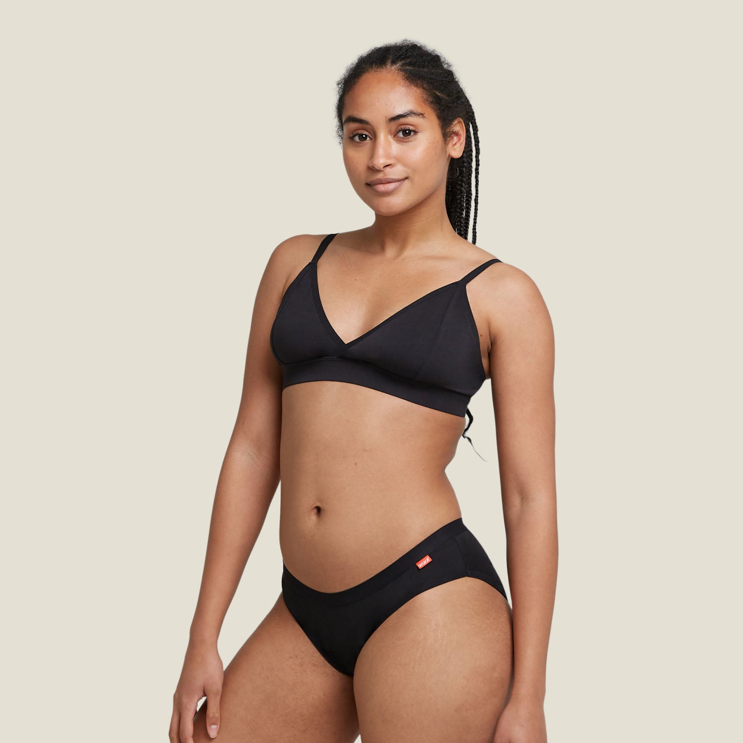 Woman wearing WUKA Basics™ Hipster period pants for heavy flow – full body front view showcasing a sleek and comfortable fit.