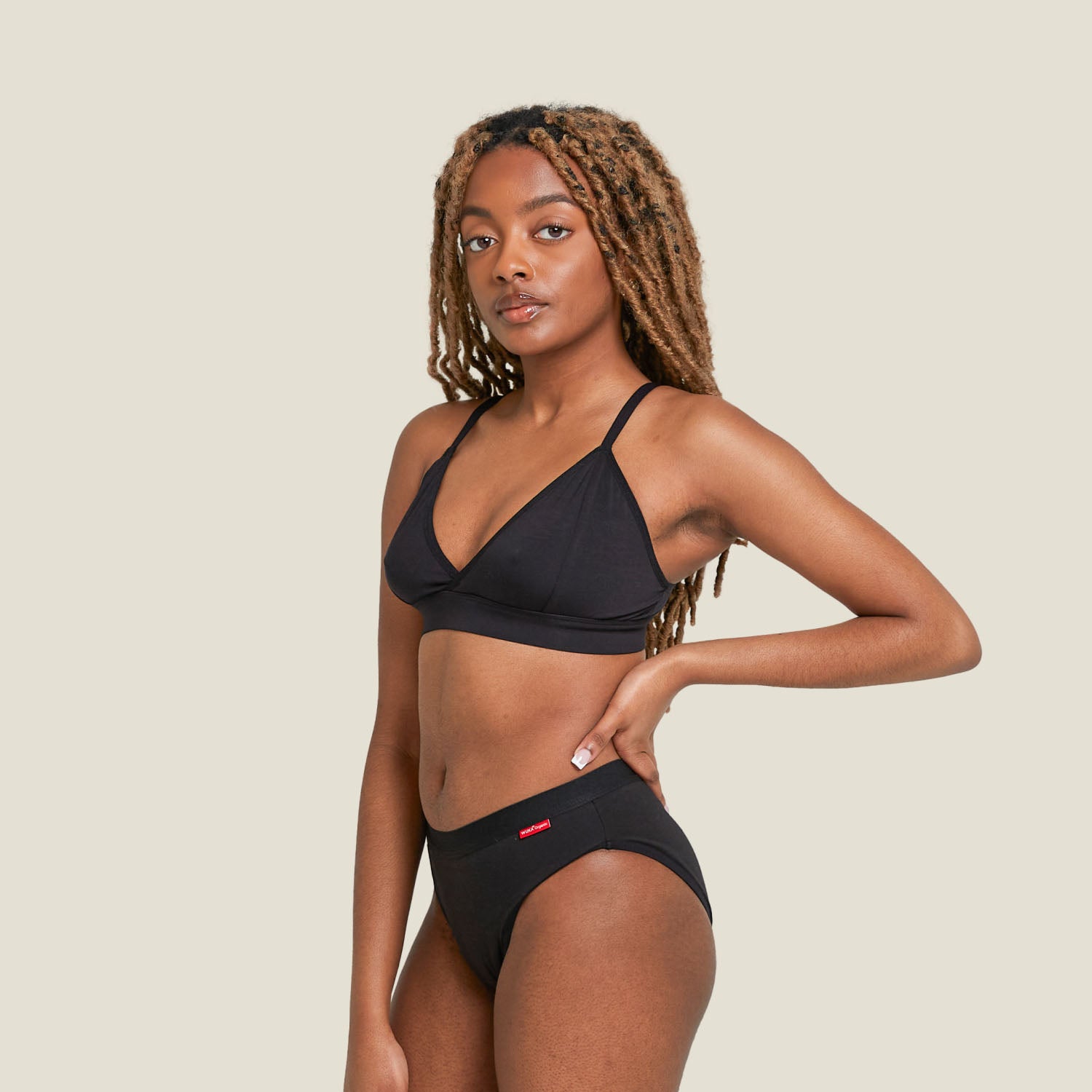 Model wearing WUKA Ultimate™ Bikini period pants for heavy flow – full-length front angle showing high-leg cut and comfort waistband.