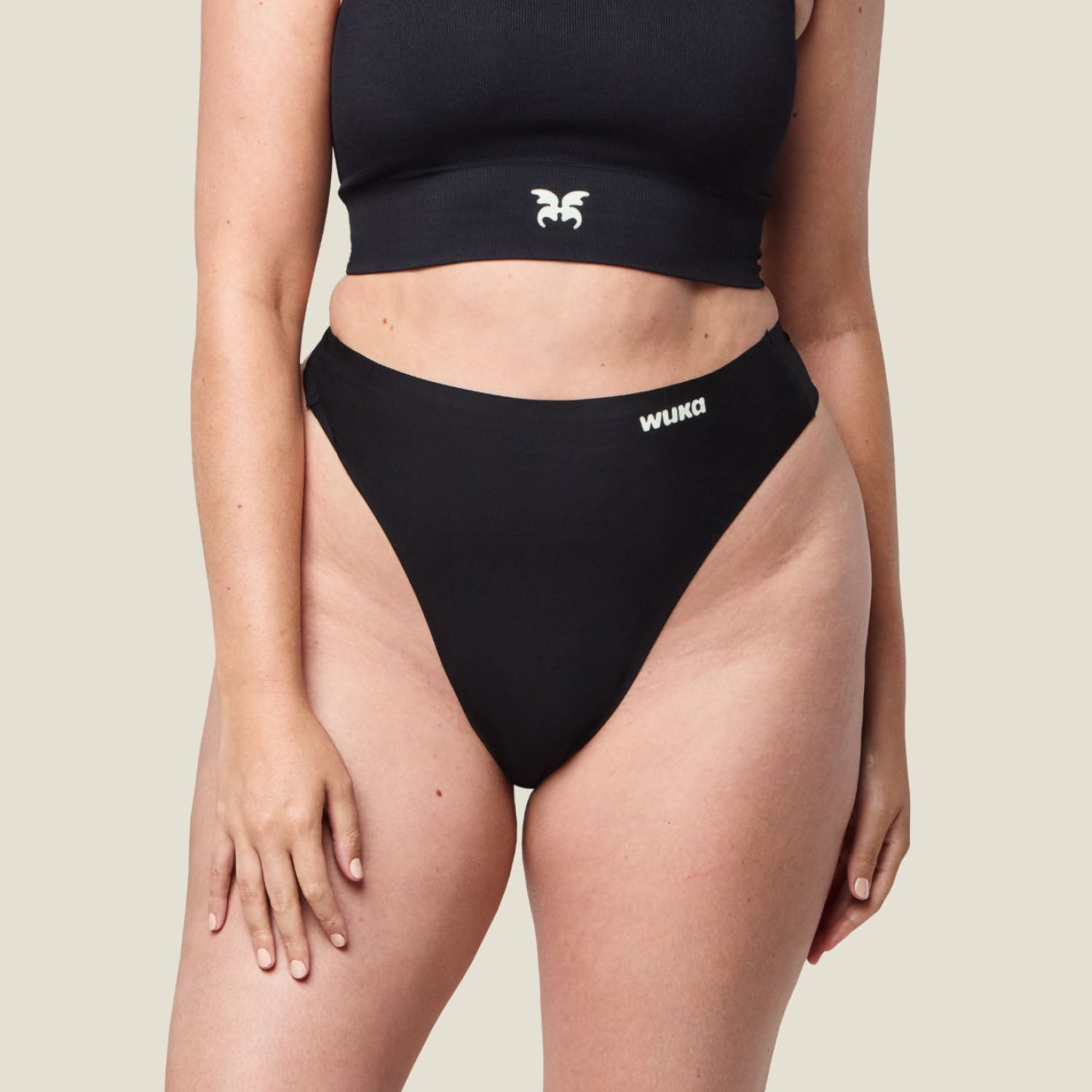 Close-up of WUKA black period thong offering discreet protection for light flow, featuring a smooth, body-hugging design.