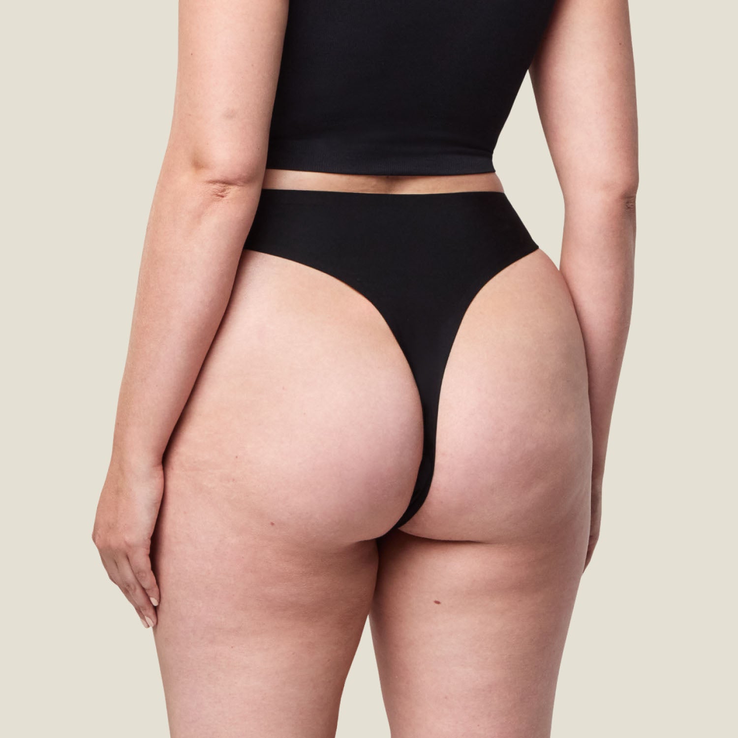 Rear view of WUKA Stretch Thong in black, showing the thong-style cut for no VPL and breathable leak-proof comfort.