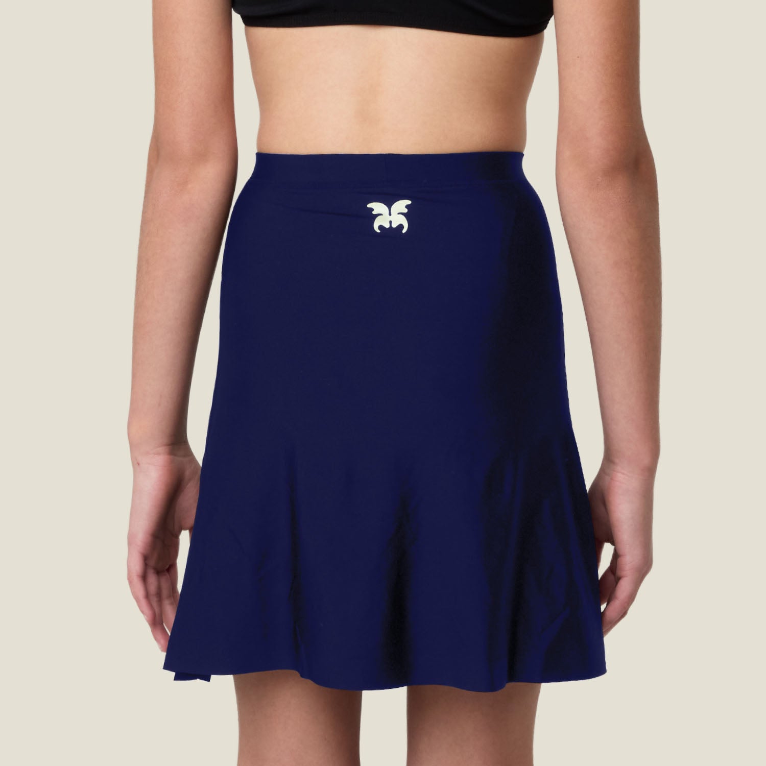 Back view of WUKA Teen Stretch Skort in navy — features built-in absorbent underwear and leak-proof layer.