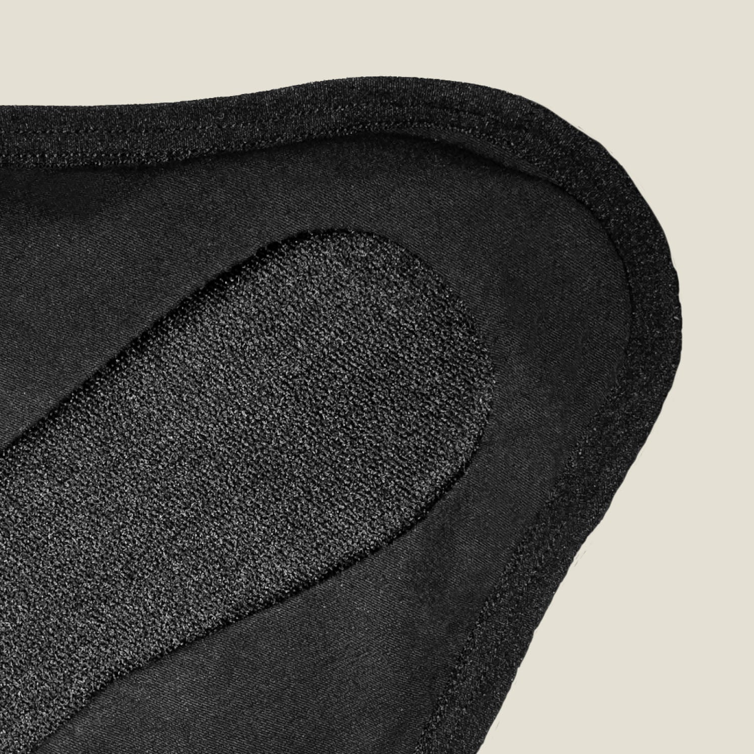 Extreme close-up of the textured absorbent inner layer on WUKA x Mooncup reusable period pad, highlighting high-performance organic cotton.