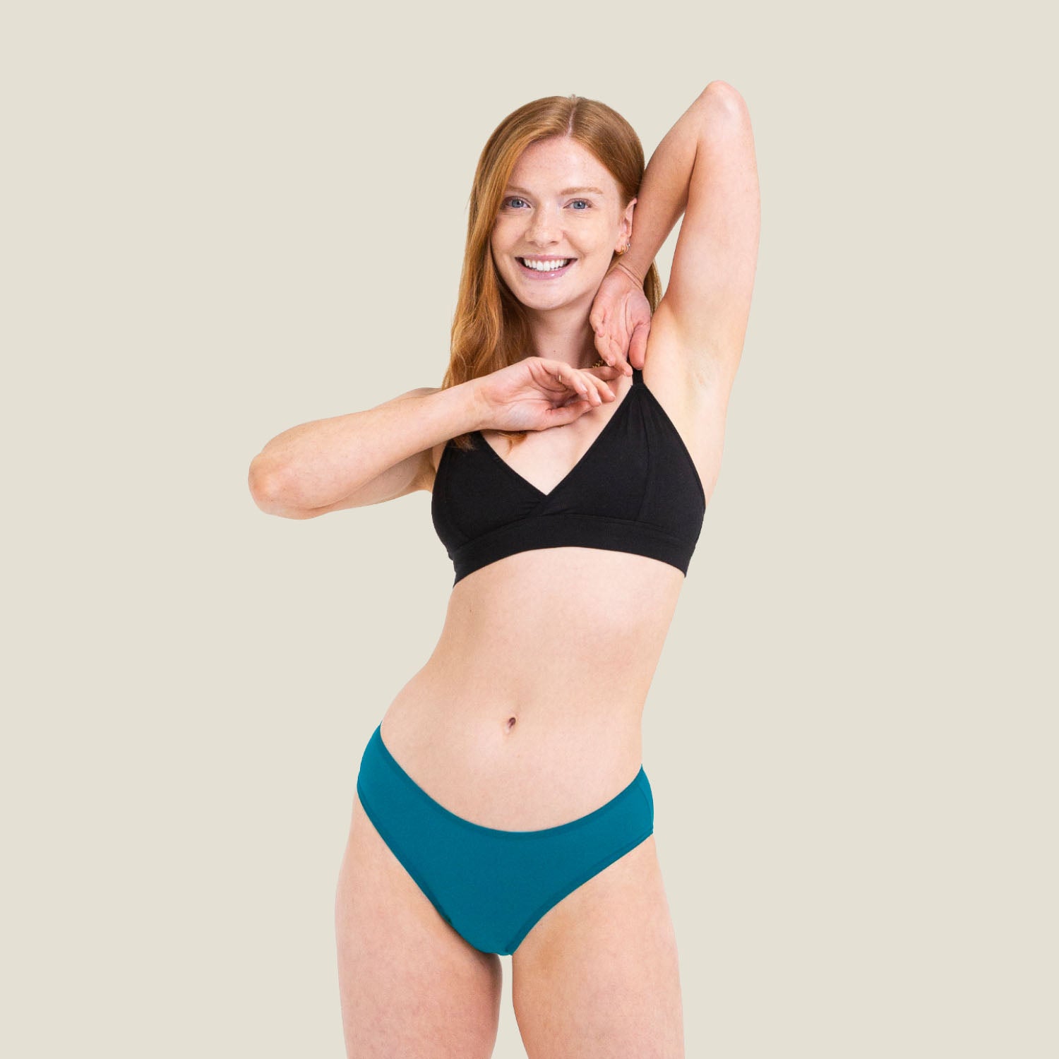 Model wearing WUKA Swim Bikini Bottom in blue, designed for light period flow with leak-proof protection.