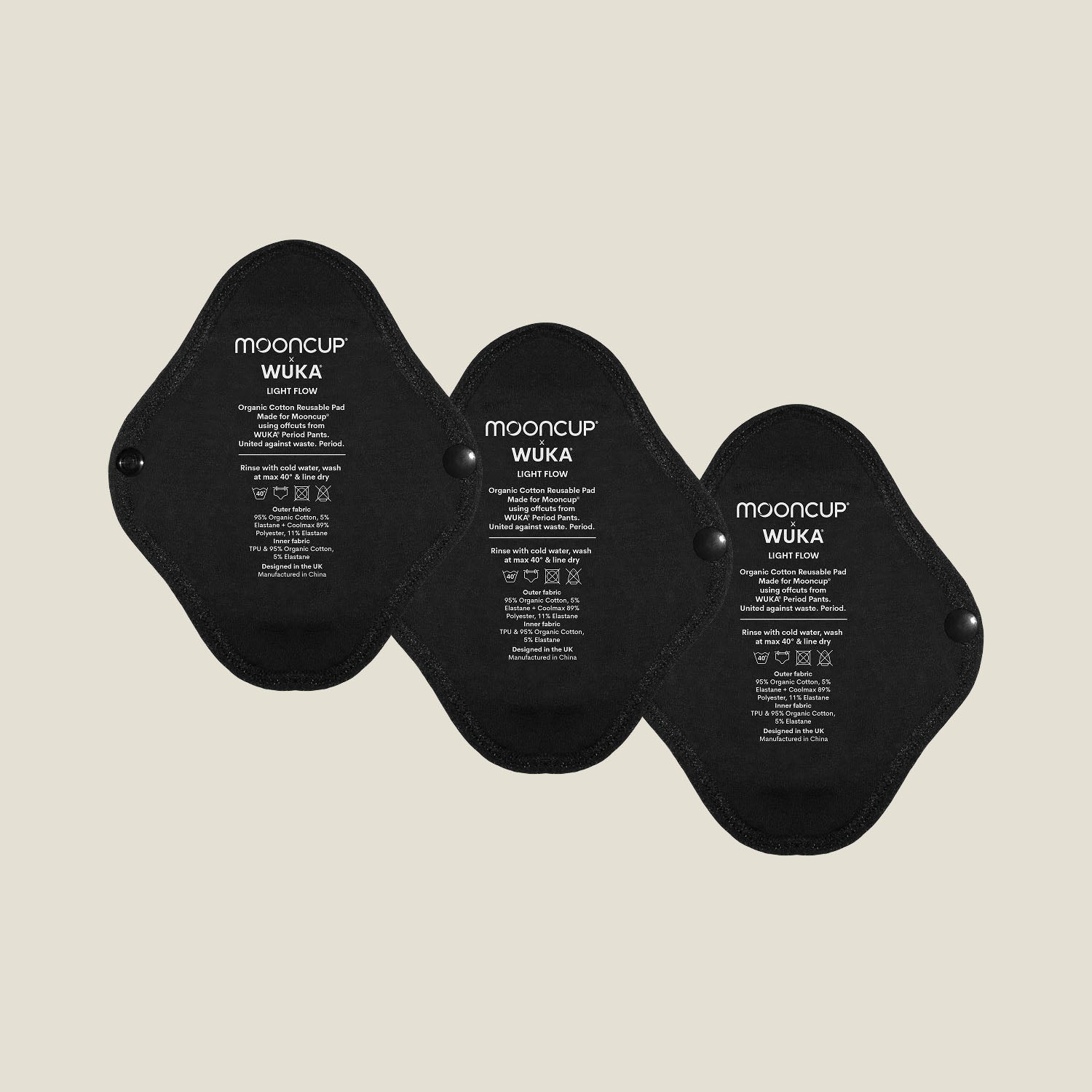 Three WUKA x Mooncup reusable panty liners for light flow, made with GOTS-certified organic cotton and designed for secure, sustainable period care.