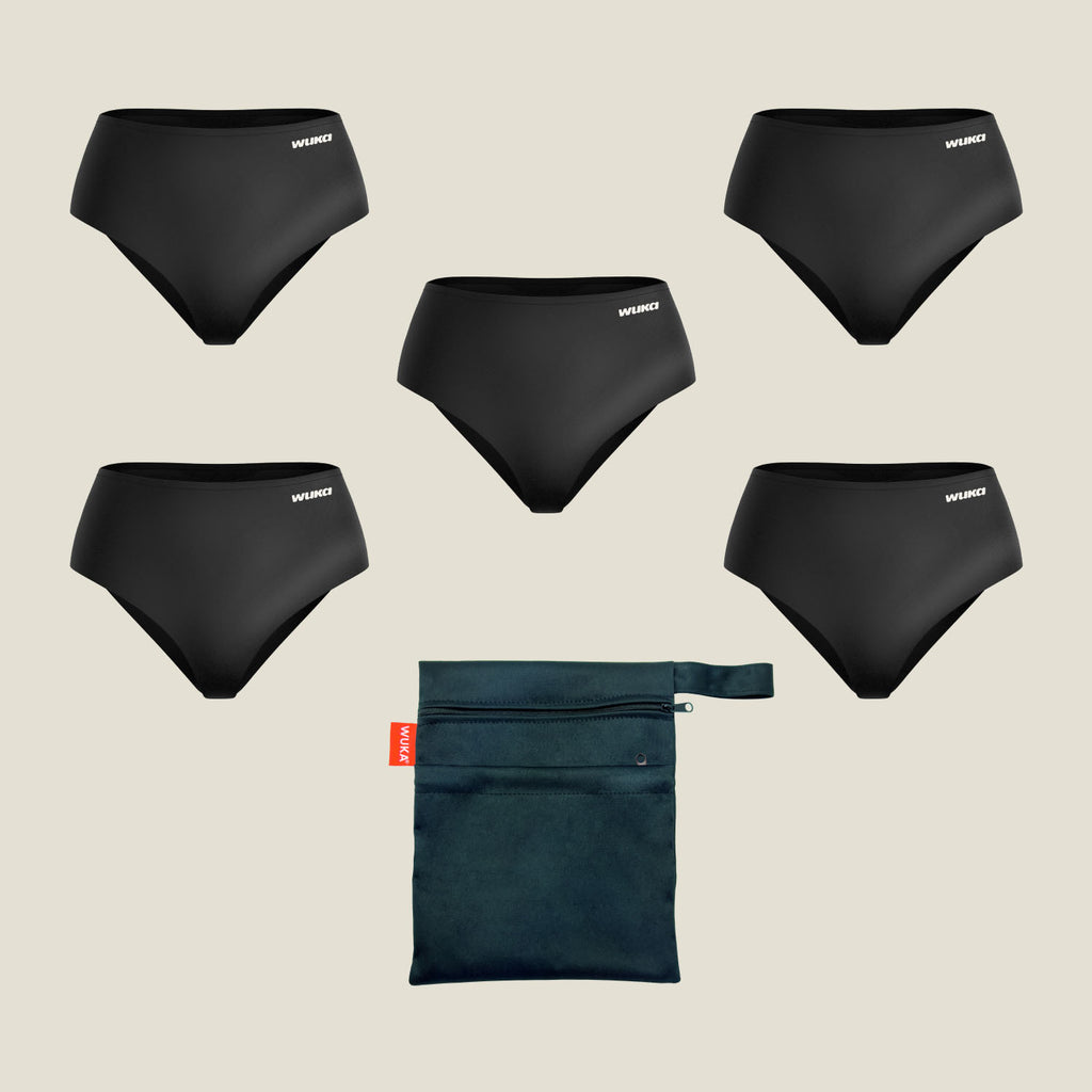 Flat lay of WUKA Teen Stretch™ Period Pants in black, showcasing a 5-pack School Week Set for mixed flow including super heavy and heavy absorbency underwear with a black waterproof carry bag.