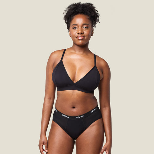 Front view of model wearing WUKA Ultimate™ Midi Brief - Heavy flow period underwear in black, offering full coverage and leak protection.