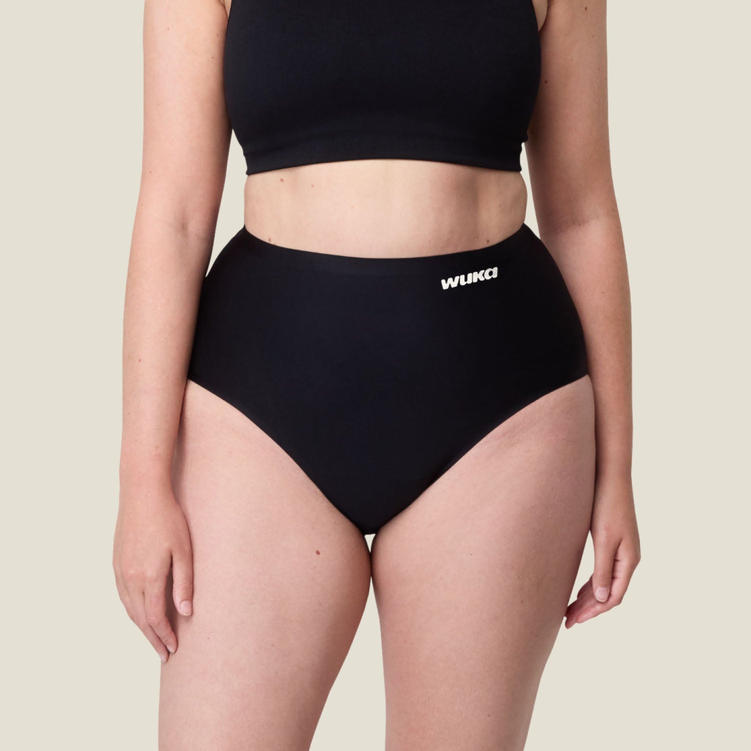 Close-up of WUKA Stretch Seamless High Waist heavy flow period underwear highlighting the high-waisted seamless fit and logo detail.