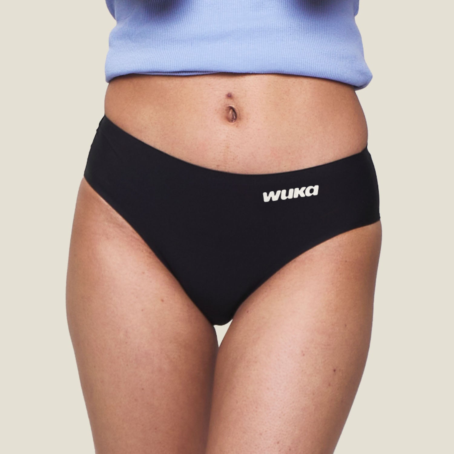 Close-up of WUKA Teen Stretch Seamless Black Period Pants for heavy flow, showing soft, flexible waistband and seamless design.