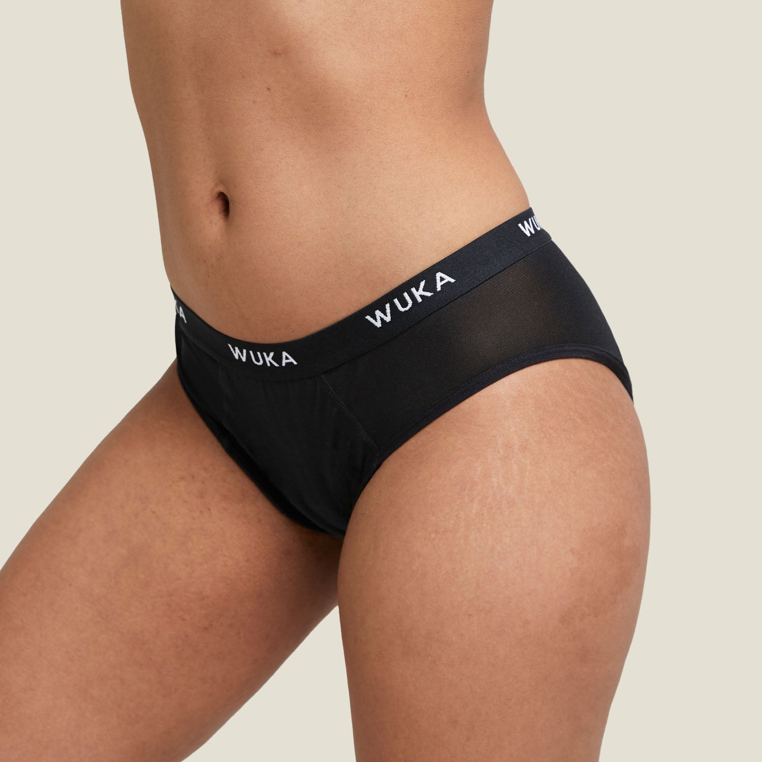 Close-up of WUKA Ultimate™ Midi Brief showing front design, soft mesh panels, and branded waistband for heavy period flow support.