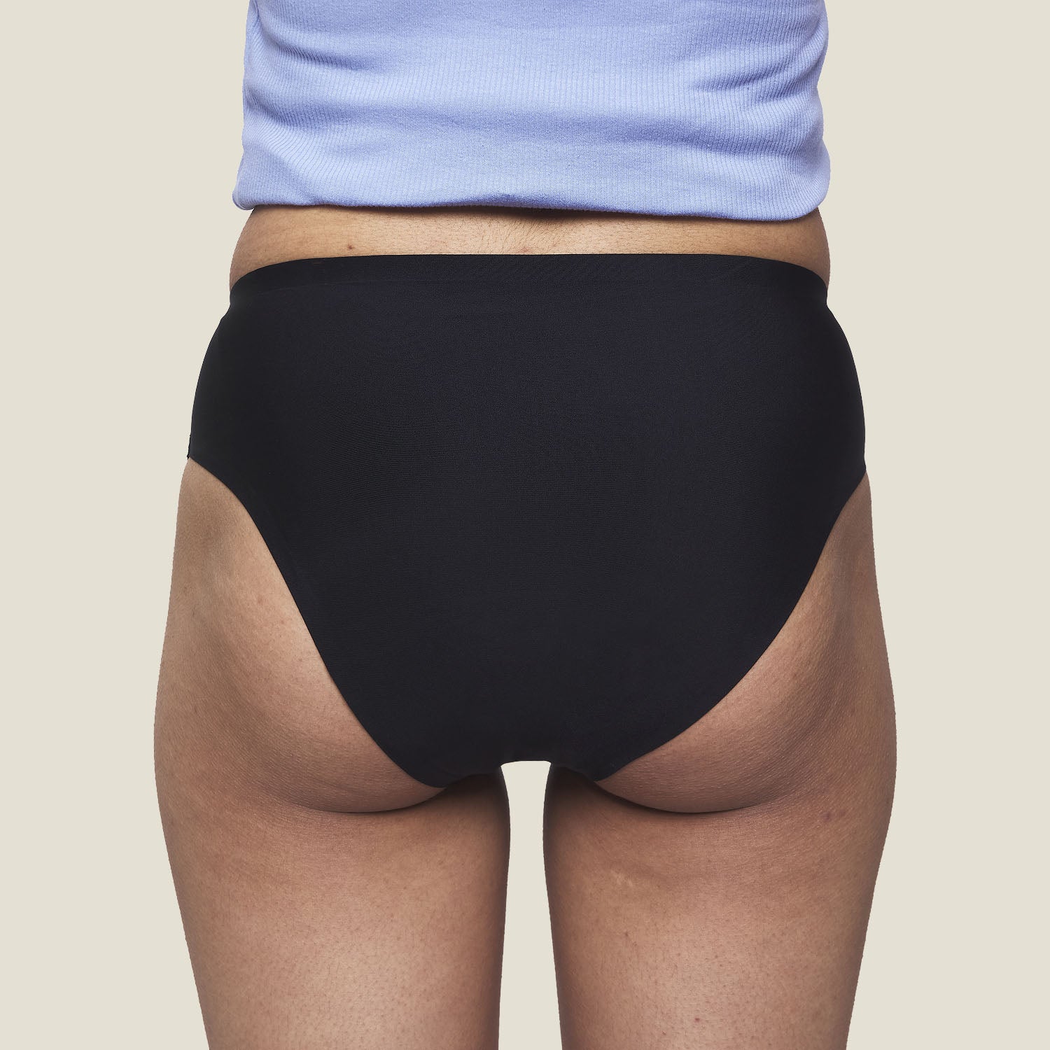 Rear view of WUKA Teen Stretch™ Super Heavy Period Pants – seamless and discreet black underwear offering 12-hour leak protection for teens.