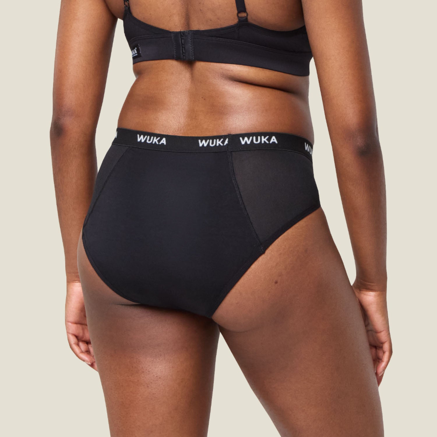 Rear view of WUKA Ultimate™ Midi Brief - Heavy flow period pants, displaying seamless design and breathable fabric panels.