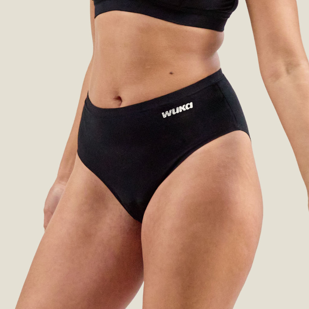 Side view of the WUKA Stretch Cotton Midi Brief designed for heavy period flow, featuring soft cotton fabric and stretchable waistband.