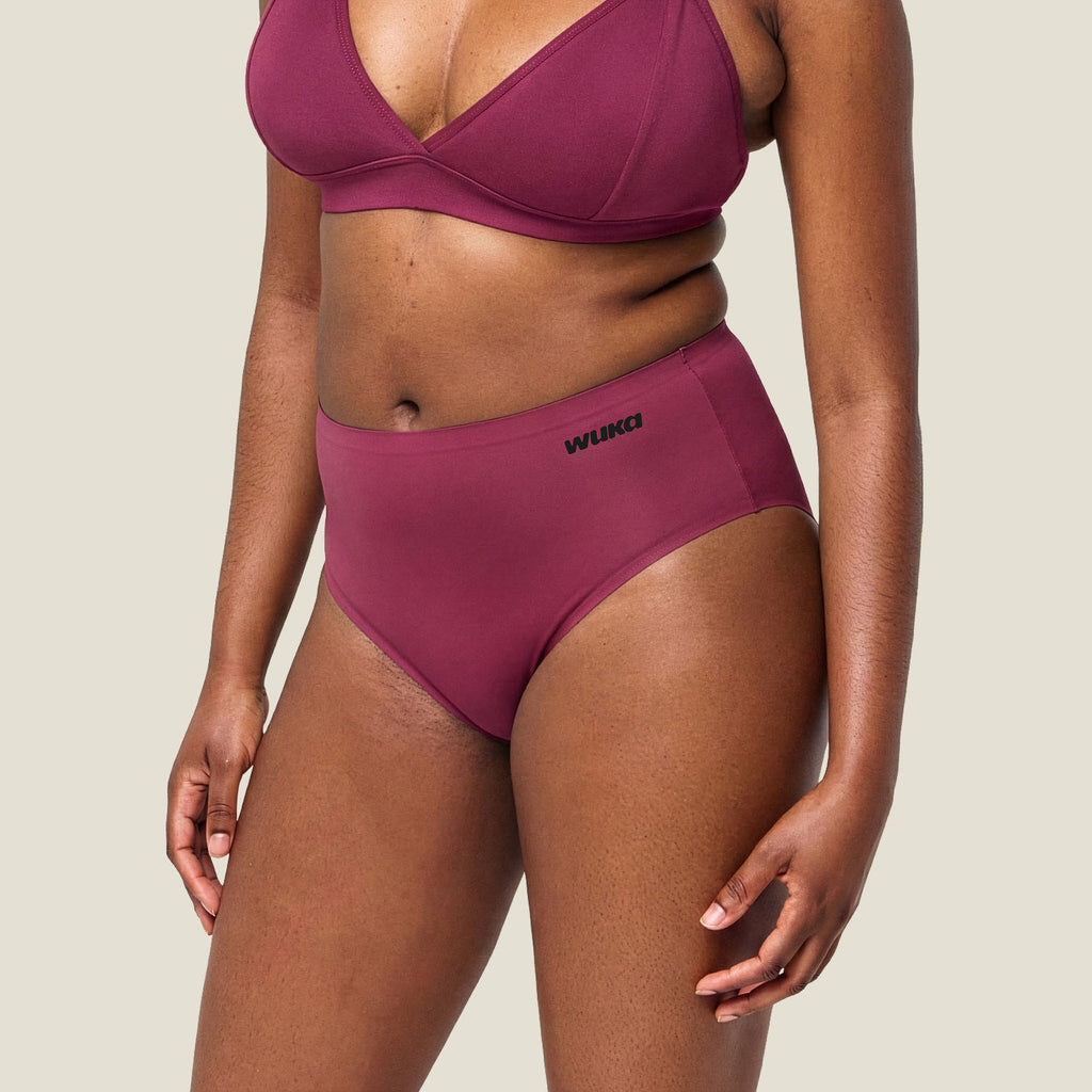 Side profile of WUKA Stretch Midi Brief in Burgundy – showing flexible fit and sleek period underwear design
