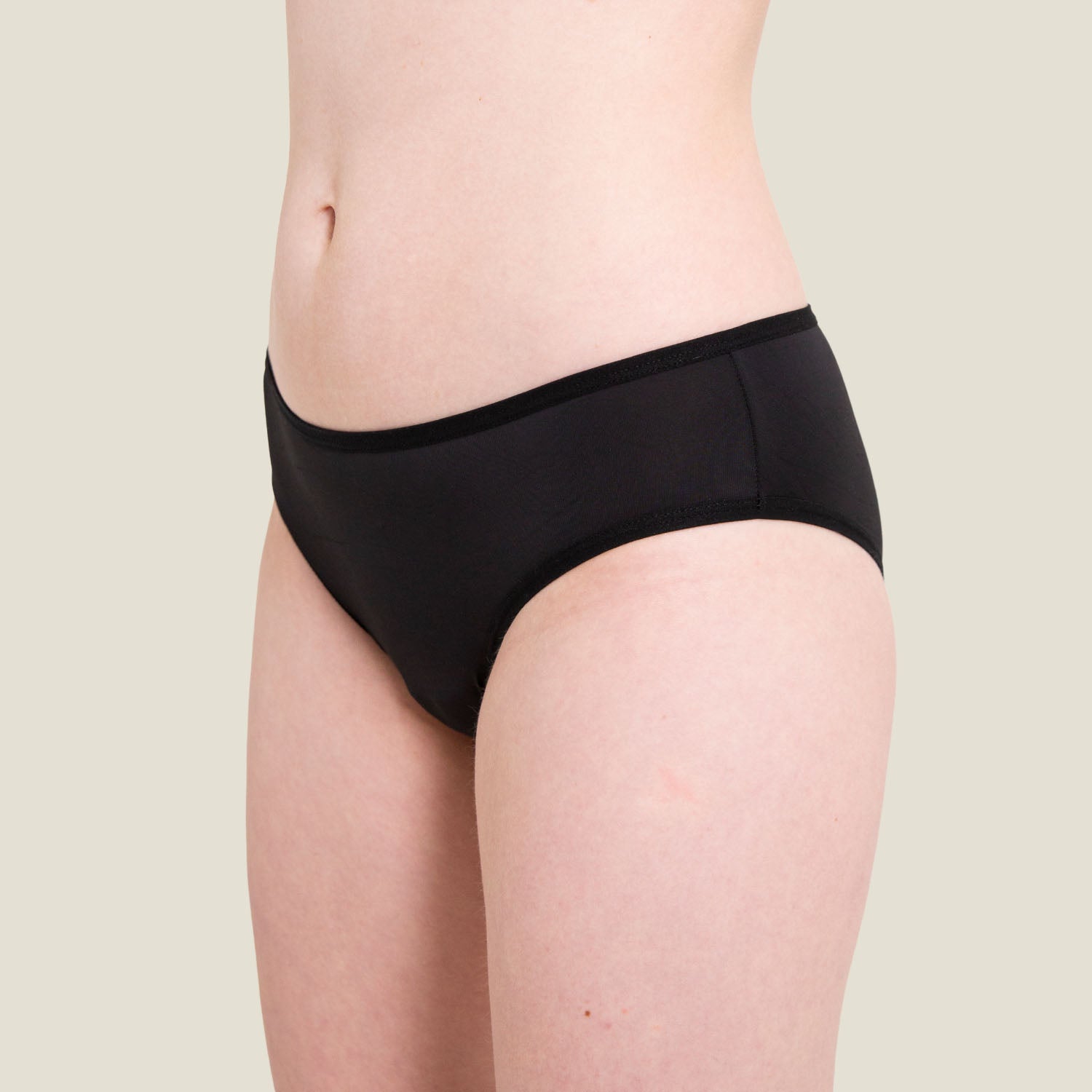 Side angle of WUKA Teen Swim Bikini Brief in black, highlighting seamless comfort and secure waistband designed for active teens.