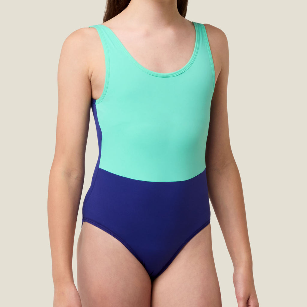 Angled front view of WUKA Teen Period Swimsuit in two-tone Green and Blue, highlighting leak-proof design and secure fit for active teens.