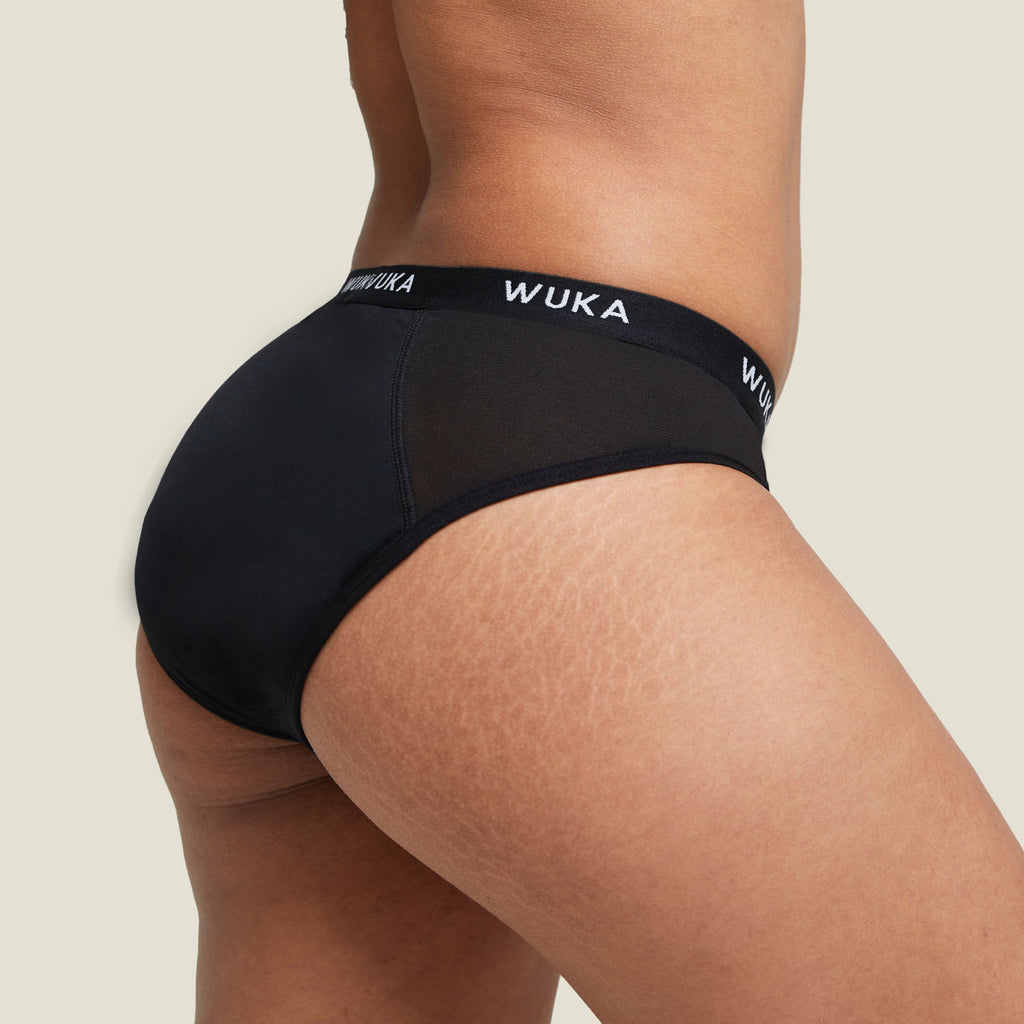 Side view of the WUKA Ultimate™ Midi Brief showcasing the mid-rise cut and seamless fit around the hips and thighs.