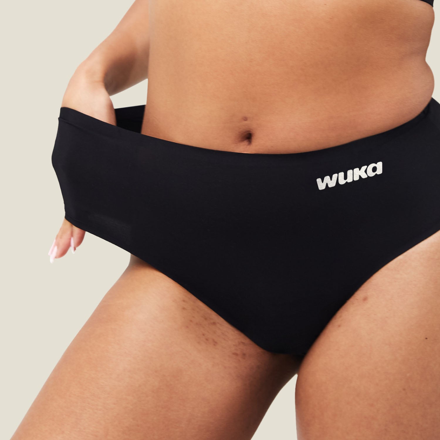 Close-up detail of WUKA Stretch Seamless Midi Brief waistband, showing 4-way stretch and flexibility for adaptable fit during medium flow days.
