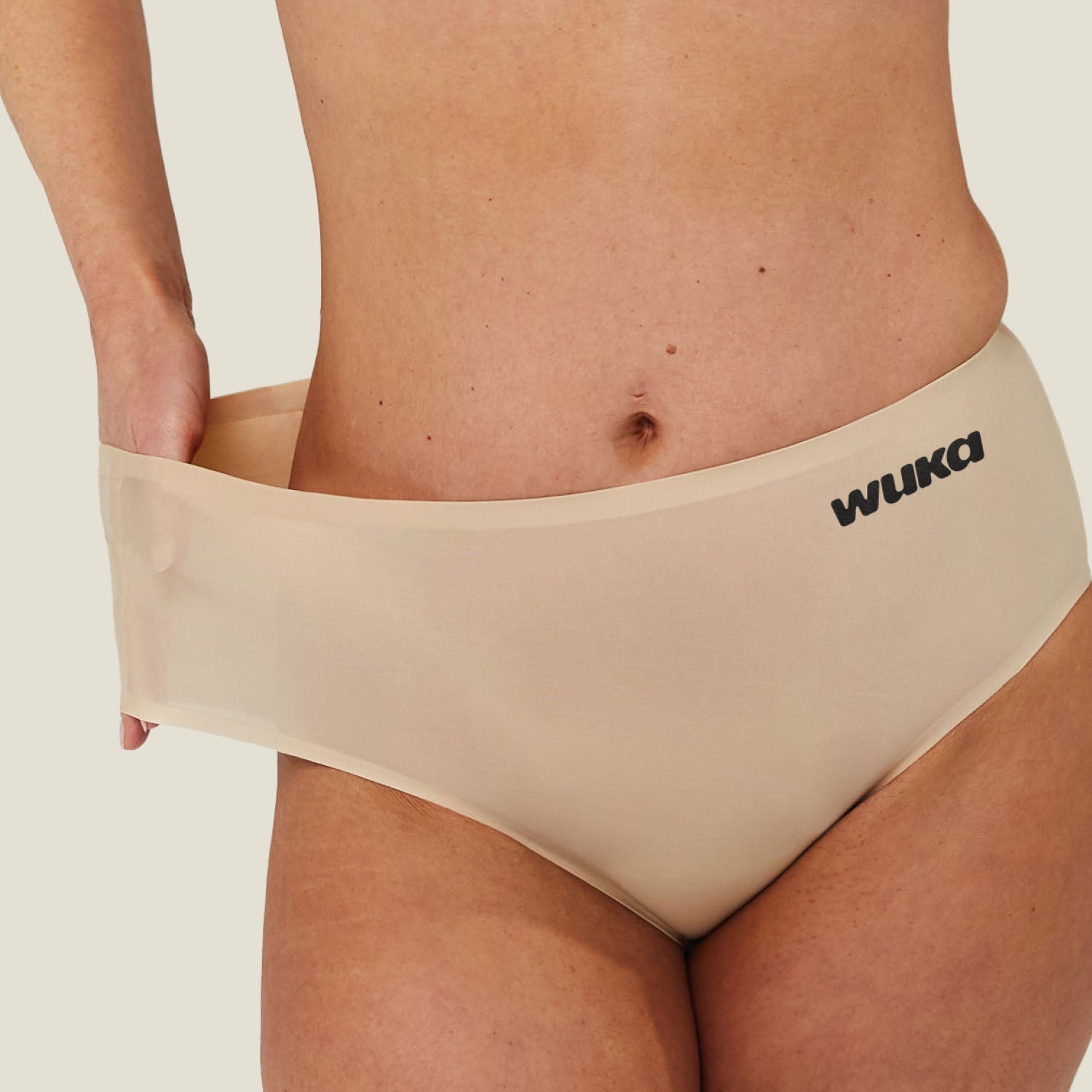 Close-up of stretchy waistband on WUKA Light Nude heavy flow seamless period underwear, demonstrating flexible fit and comfort.