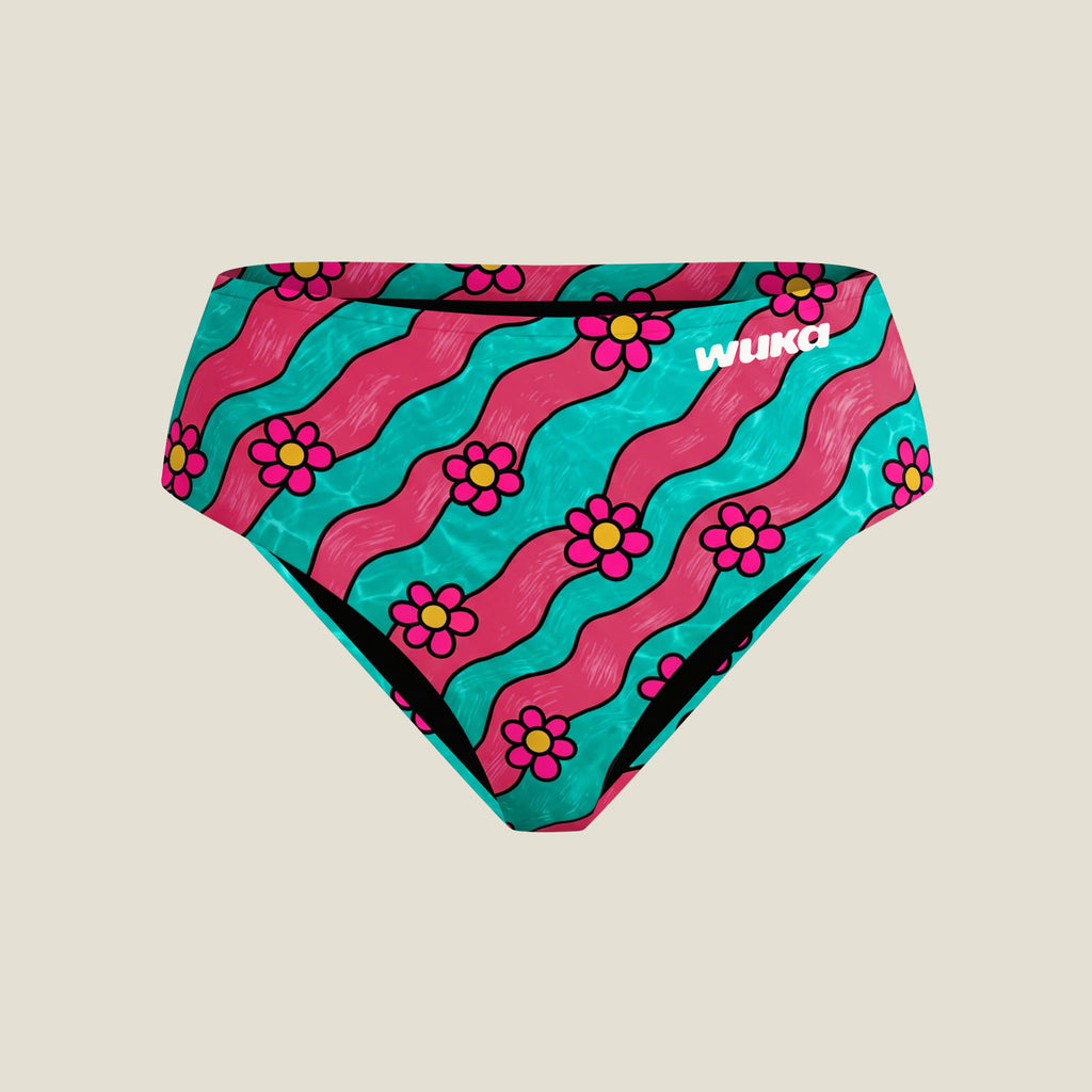 A pair of teen midi brief period pant bottoms featuring a retro pattern of pink and turquoise wavy stripes with pink flowers and yellow centres, with the brand name 'WUKA' printed in white on the right side.