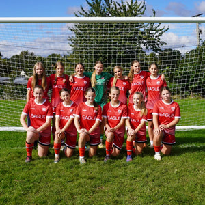Girls’ grassroots football team wearing WUKA period-proof sports shorts, sharing positive testimonials about confidence and comfort during matches on their period