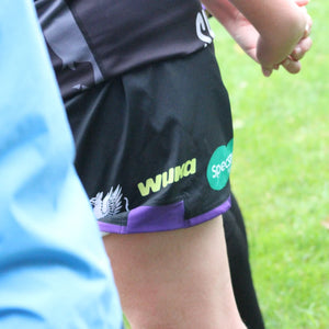 Close-up of WUKA logo on girls’ rugby kit, highlighting club testimonials on leak-proof protection and confidence during contact sport